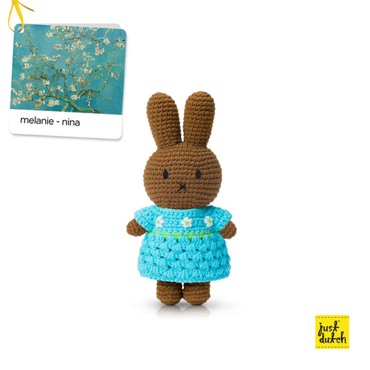 melanie crochet doll wearing blue almond blossom dress handmade soft toy
